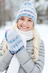 Image showing smiling young woman in winter forest