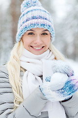 Image showing smiling young woman in winter forest