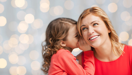 Image showing happy daughter whispering gossip to her mother