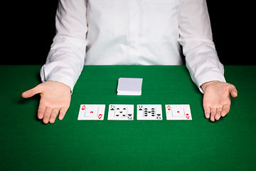 Image showing holdem dealer with playing cards