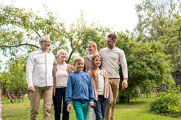Image showing happy family in front of house outdoors