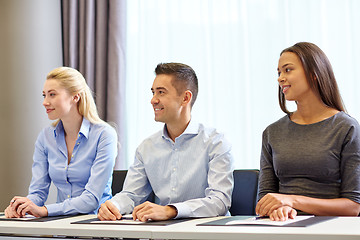 Image showing group of smiling businesspeople meeting in office