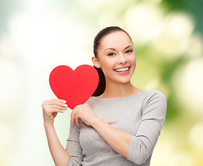 Image showing smiling asian woman with red heart