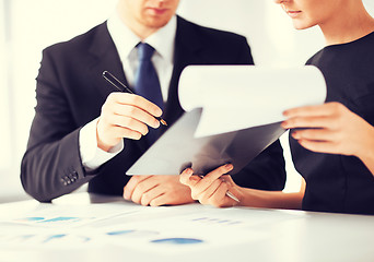 Image showing businessman and businesswoman signing paper