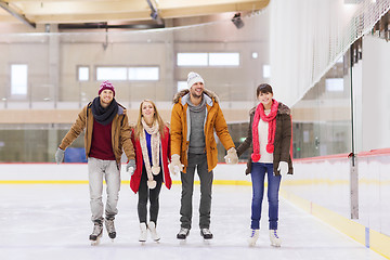 Image showing happy friends on skating rink