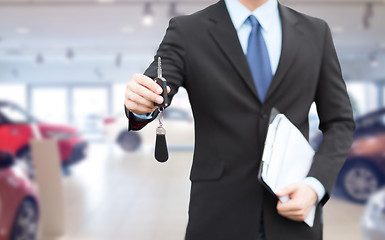 Image showing close up of businessman or salesman giving car key