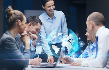 Image showing smiling female boss talking to business team