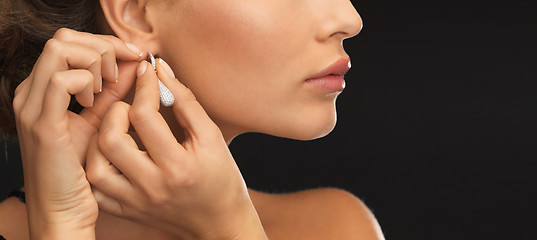 Image showing woman wearing shiny diamond earrings