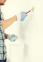 Image showing man with paintbrush and pot