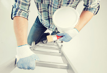 Image showing man with paintbrush and pot