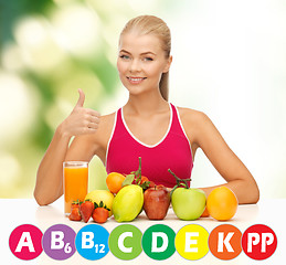 Image showing happy woman with organic food and vitamins