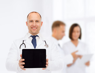 Image showing smiling male doctor with stethoscope and tablet pc