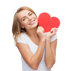 Image showing smiling woman in white t-shirt with heart