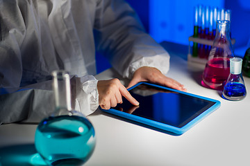 Image showing close up of scientist with tablet pc in laboratory