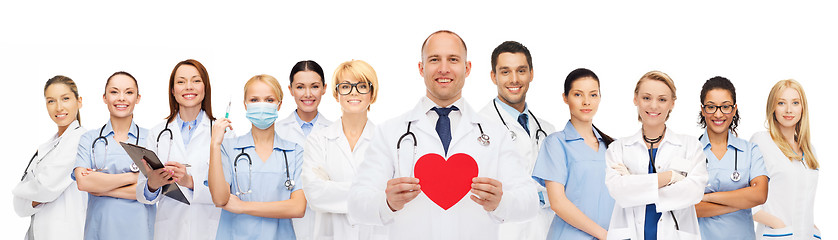 Image showing group of smiling doctors with red heart shape