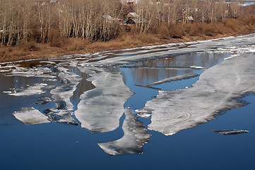 Image showing Thawing ice floats down river