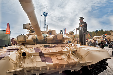 Image showing Officer of foreign army studies tank T-72. Russia