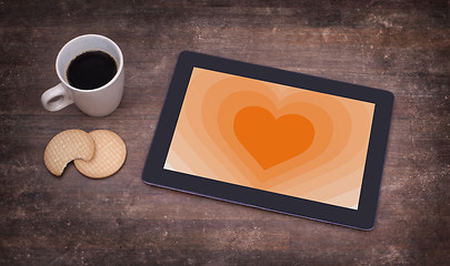 Image showing Heart shape backgound on tablet