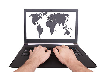 Image showing Man working on laptop, world map