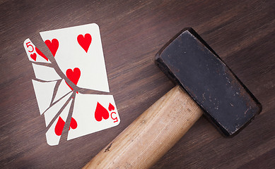 Image showing Hammer with a broken card, five of hearts