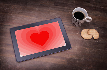 Image showing Heart shape backgound on tablet