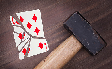 Image showing Hammer with a broken card, seven of diamonds