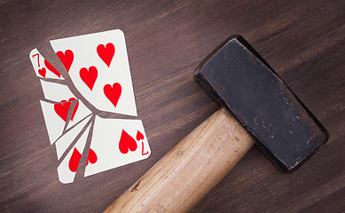 Image showing Hammer with a broken card, seven of hearts