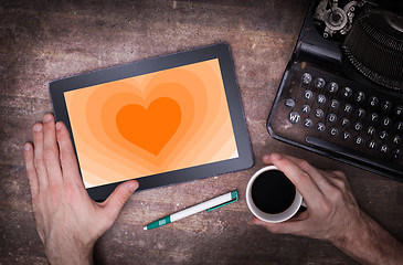 Image showing Heart shape backgound on tablet