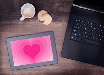 Image showing Heart shape backgound on tablet