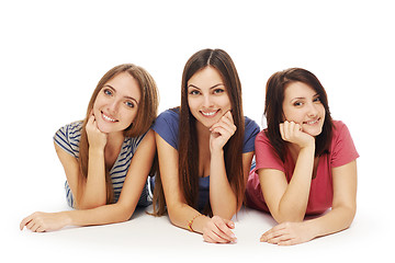 Image showing Girls friends lying smiling on floor