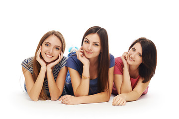 Image showing Girls friends lying smiling on floor