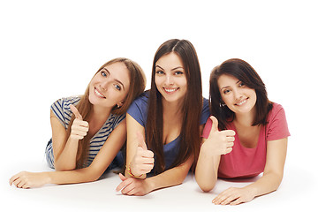 Image showing Girls friends lying smiling on floor