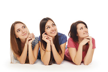 Image showing Girls friends lying smiling on floor