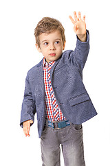 Image showing little boy with with his hand lifted up