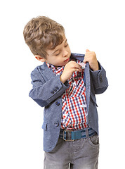 Image showing little boy puts money in his pocket