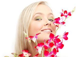 Image showing lovely blond with orchid #2