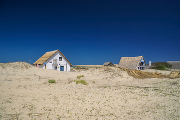 Image showing Houses in sand dunes