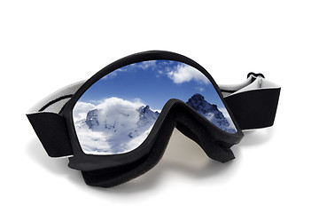 Image showing Ski goggles with reflection of winter mountains