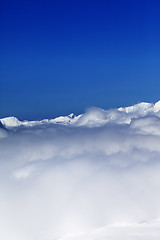 Image showing Cloudy mountains at nice sun day