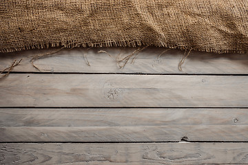 Image showing Wood background with hessian textile