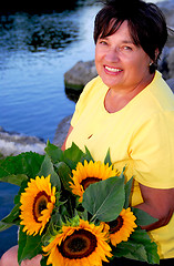 Image showing Woman sunflowers