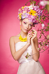 Image showing Beautiful girl with flowers in her hair. Spring.