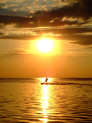 Image showing Silhouette of a kitesurf on a gulf on a sunset