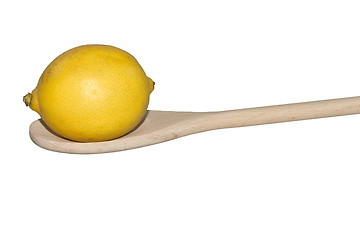 Image showing Lemon on a light wooden spoon