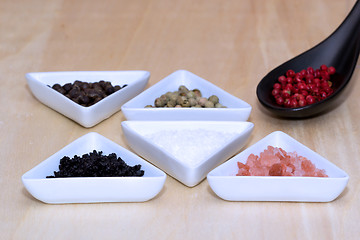 Image showing Variety of peppercorns and salt