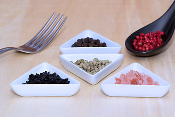 Image showing Variety of peppercorns and salt