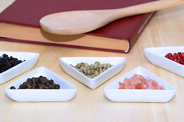 Image showing Variety of peppercorns and salt