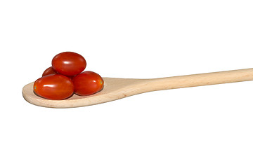 Image showing Grape tomatoes on a light wooden spoon