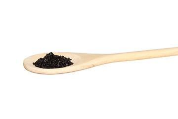 Image showing Black salt on a light colored wooden spoon