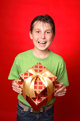 Image showing Child holding gift